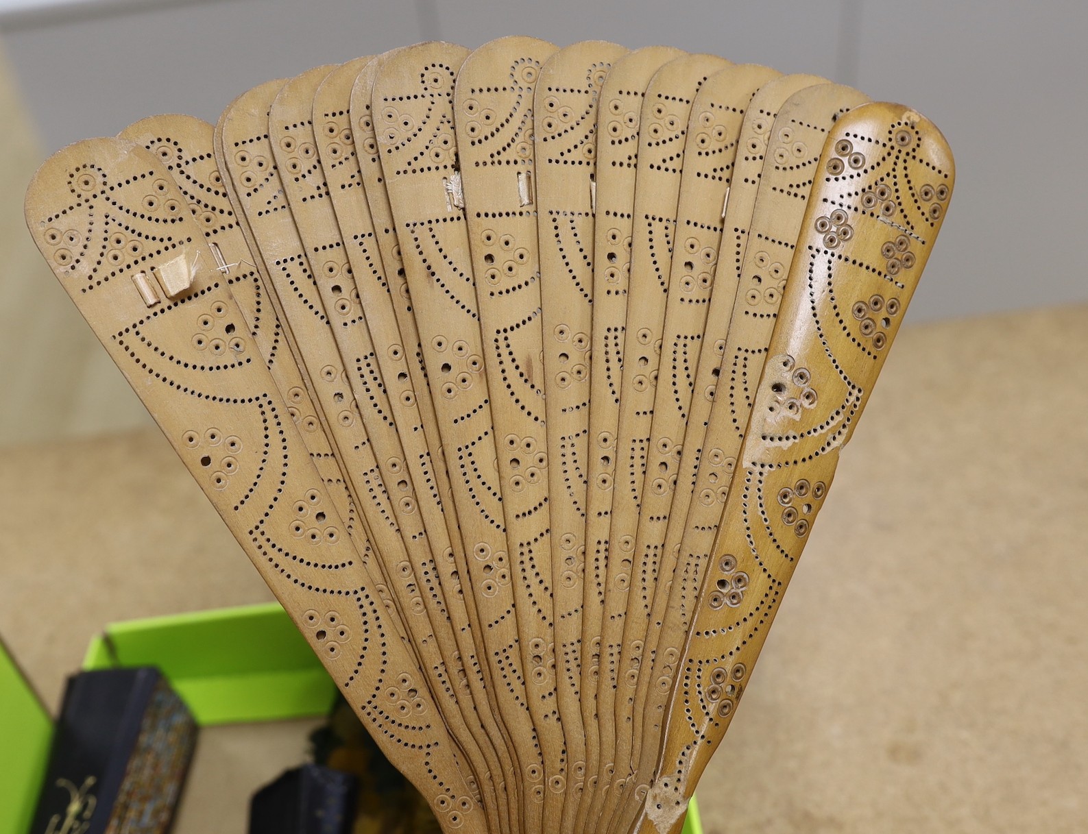 An unusual 19th century feather fan, three sequin and gauze fans, a paisley fan, Sandalwood fan and a collection of later fans and stick guards, feather fan 33cms high